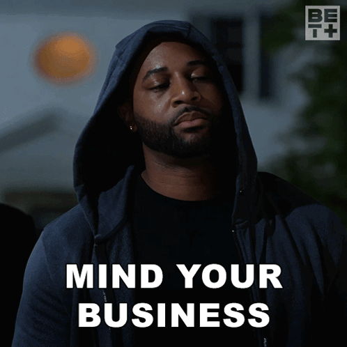A Man Wearing A Hooded Jacket Says " Mind Your Business " GIF
