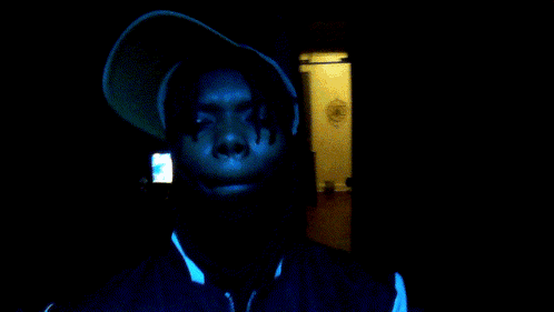 A Man Wearing A Hooded Jacket With A Nike Logo On It GIF
