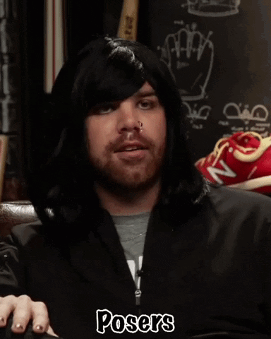 A Man Wearing A Hooded Jacket With The Word Posers On The Bottom GIF