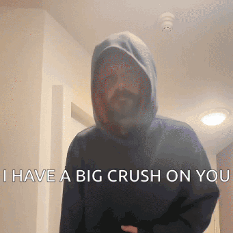 A Man Wearing A Hooded Sweatshirt Says " I Have A Big Crush On You " GIF
