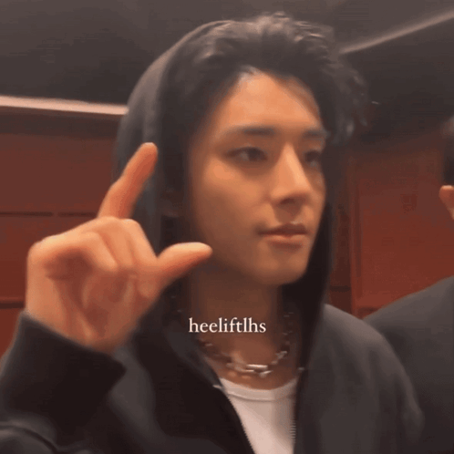 A Man Wearing A Hoodie And A Necklace Has The Hashtag Heelliftlhs On The Bottom Right GIF