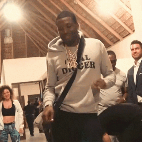 A Man Wearing A Hoodie That Says All Digger Is Dancing GIF