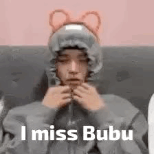 A Man Wearing A Hoodie With Ears And The Words `` I Miss Bubu '' . GIF