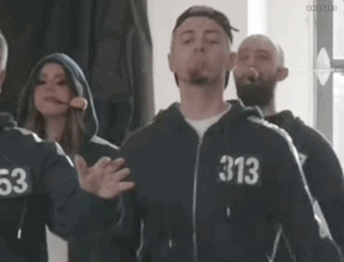 Man In Hoodie Blowing Cigarette With 313 Number GIF