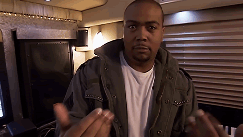 A Man Wearing A Jacket And A White Shirt Is Talking GIF