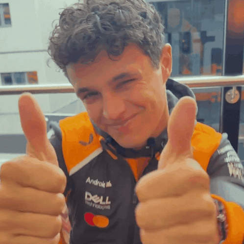 A Man Wearing A Jacket That Says Dell On It GIF