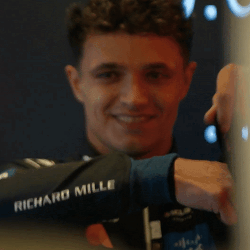 a man wearing a jacket that says richard mille
