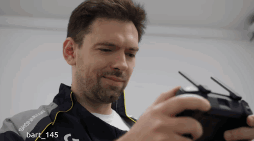 A Man Wearing A Jacket That Says Skip N Glide GIF