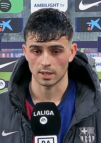 A Man Wearing A Jacket With A Laliga Logo On It GIF