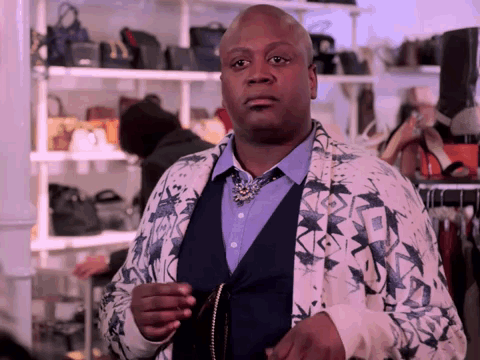 A Man Wearing A Jacket With A Pattern On It GIF