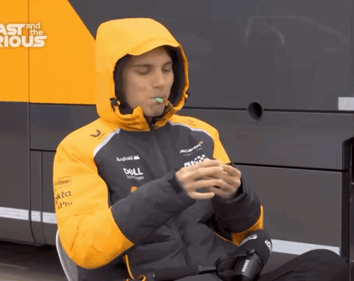 A Man Wearing A Jacket With The Word Dell On The Sleeve GIF