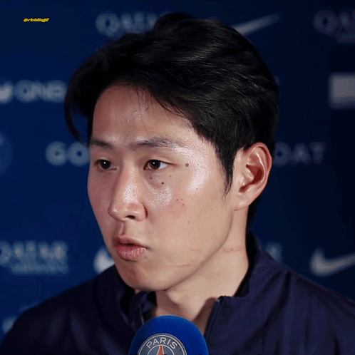 A Man Wearing A Jacket With The Word Paris On The Front GIF