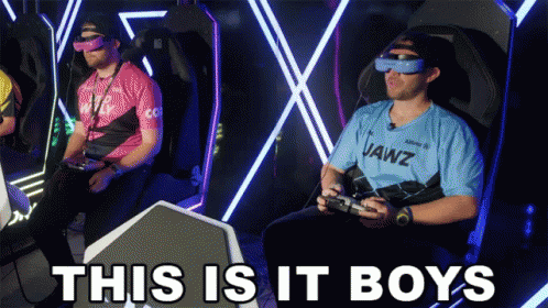 A Man Wearing A Jawz Shirt Sits In A Chair Playing A Video Game GIF
