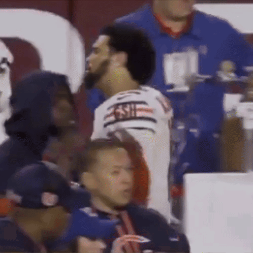 A Man Wearing A Jersey That Says 49Ers Is Talking To Another Man GIF