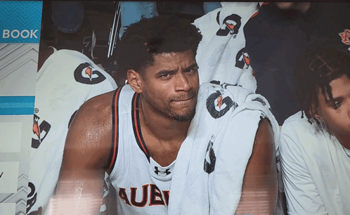 A Man Wearing A Jersey That Says Auburn Sits In The Stands GIF