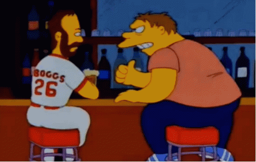 A Man Wearing A Jersey That Says Boggs 26 Is Sitting At A Bar GIF