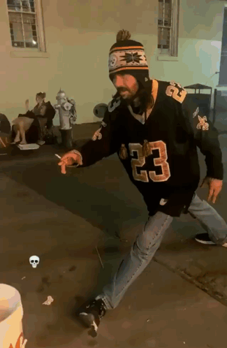 A Man Wearing A Jersey With The Number 23 On The Front GIF