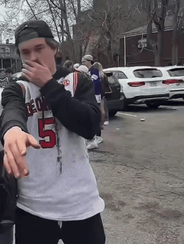 A Man Wearing A Jersey With The Number 5 GIF
