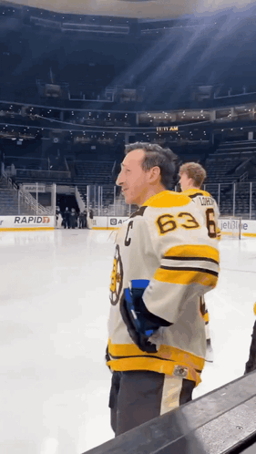 A Man Wearing A Jersey With The Number 63 On The Back GIF