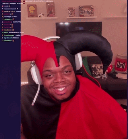 A Man Wearing A Jester Hat And Headphones Is Smiling In Front Of A Screen That Says ' Across The Seat ' GIF