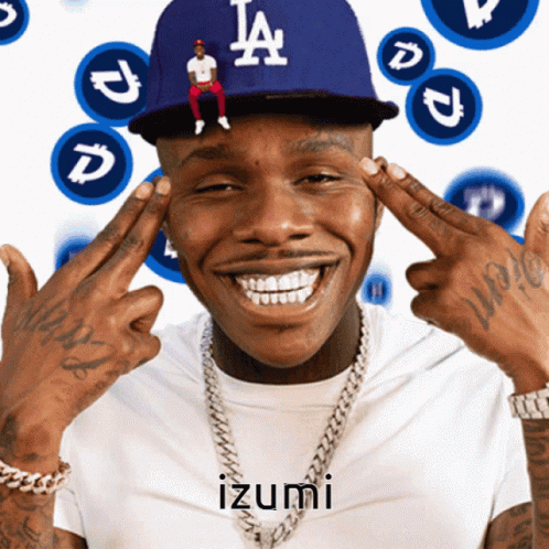 A Man Wearing A La Dodgers Hat Is Smiling With His Hands On His Forehead GIF
