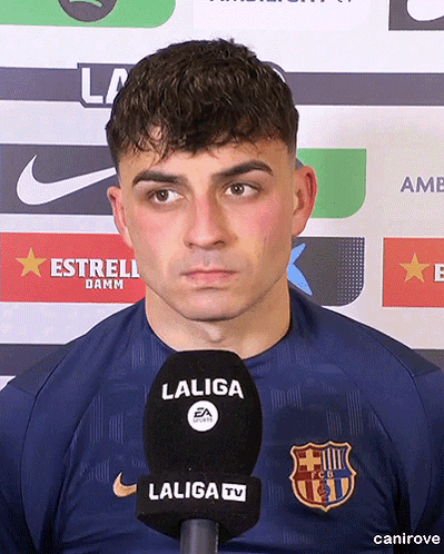 A Man Wearing A Laliga Shirt Stands In Front Of A Laliga Tv Microphone GIF