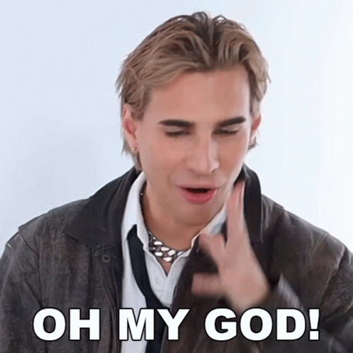 A Man Wearing A Leather Jacket And Tie Is Saying Oh My God GIF