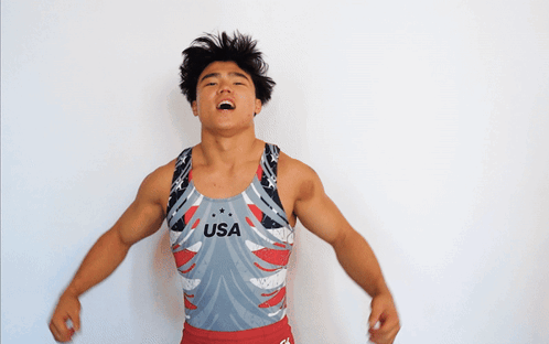 A Man Wearing A Leotard That Says Usa On The Front GIF