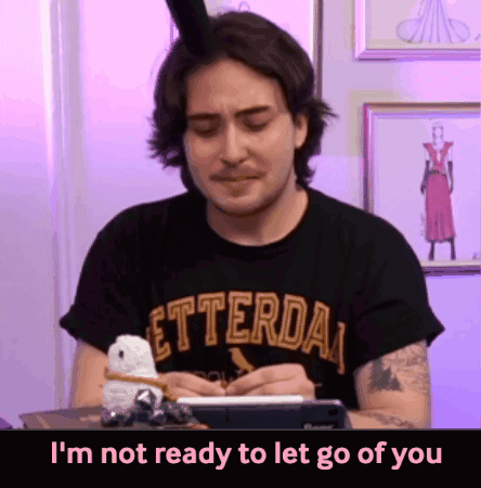A Man Wearing A Letterda T-Shirt Is Writing On A Notepad GIF