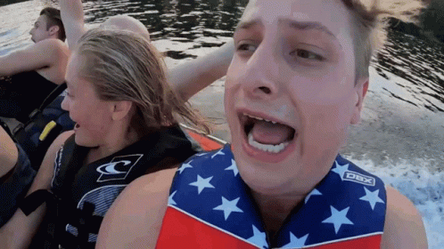 A Man Wearing A Life Vest That Says Dbx On The Front GIF
