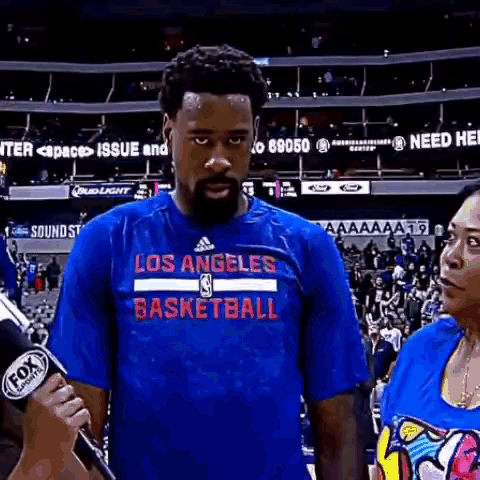 Man In Los Angeles Basketball Shirt Being Interviewed GIF