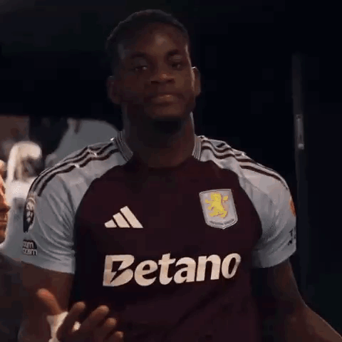 A Man Wearing A Maroon Jersey That Says Betano On The Front GIF