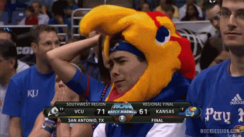 A Man Wearing A Mascot Hat Watches A Basketball Game GIF