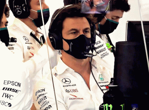 A Man Wearing A Mask And A Bose Headset GIF