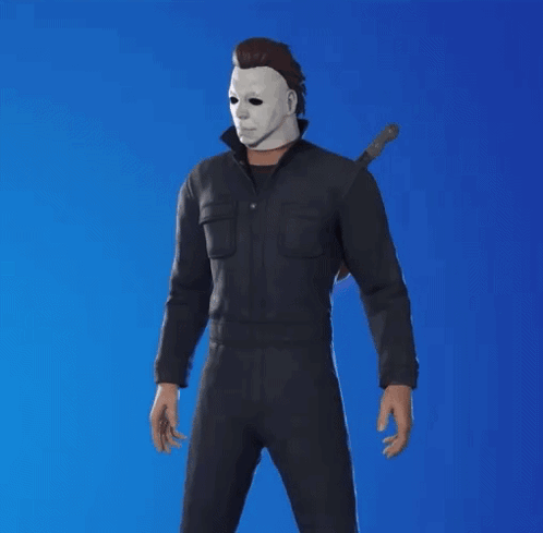 a man wearing a mask and holding a knife stands in front of a blue background