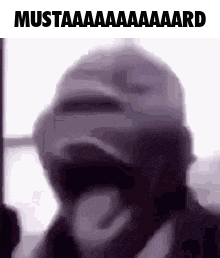 A Man Wearing A Mask Is Making A Funny Face . GIF