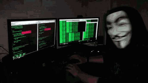 A Man Wearing A Mask Is Typing On A Computer Keyboard GIF