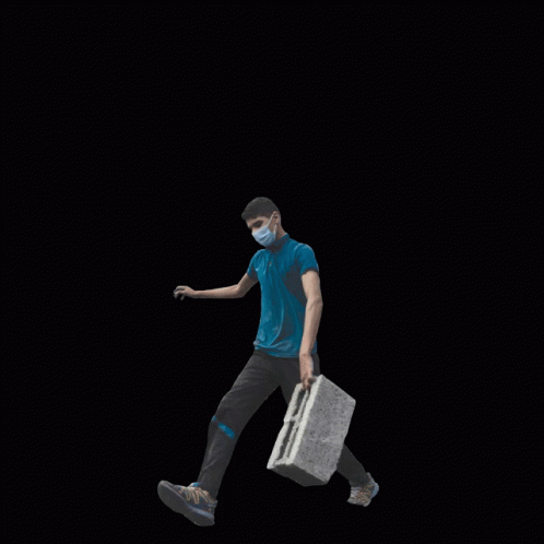 A Man Wearing A Mask Is Walking Through A Pile Of Rubble With The Words Invest In The People Not The War Behind Him GIF