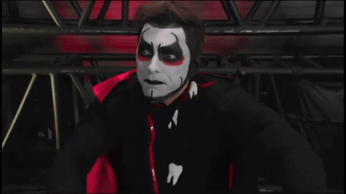 A Man Wearing A Mask Says Backlash In White Letters GIF