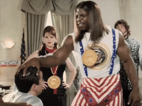 A Man Wearing A Medal Around His Neck Has A Pepsi Sign Behind Him GIF