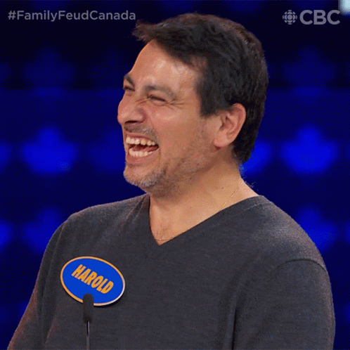 A Man Wearing A Name Tag That Says Harold Is Laughing GIF