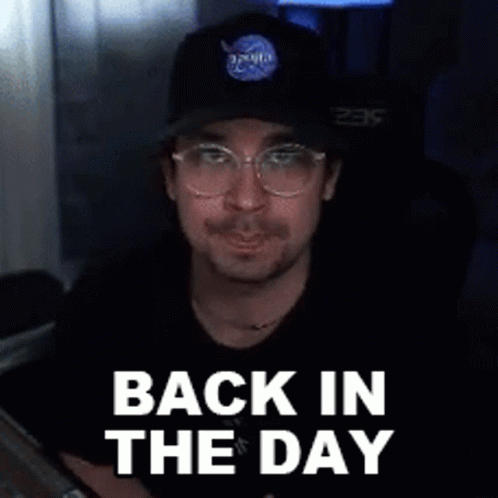 A Man Wearing A Nasa Hat And Glasses Is Smiling And Says Back In The Day . GIF