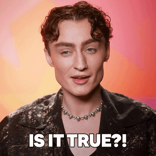 A Man Wearing A Necklace With The Words Is It True On The Bottom GIF