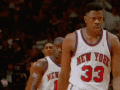 A Man Wearing A New York Jersey Number 33 Walks On The Court GIF
