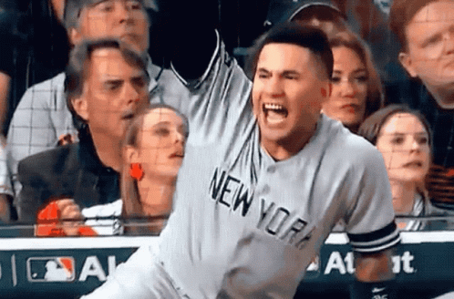A Man Wearing A New York Jersey Screams In The Air GIF