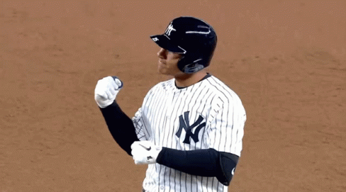 A Man Wearing A New York Yankees Baseball Uniform GIF