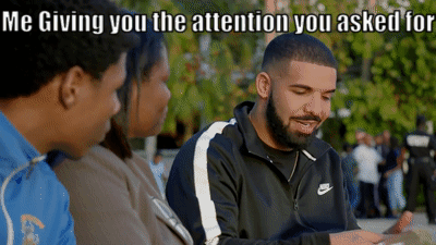 A Man Wearing A Nike Jacket Is Talking To Two Other People GIF
