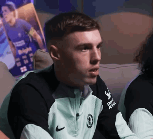 A Man Wearing A Nike Jacket That Says Inspire 4 The World On It GIF