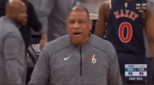 A Man Wearing A Number 6 Jersey Stands In Front Of A Basketball Player GIF