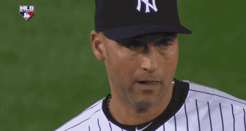 A Man Wearing A Ny Yankees Hat Adjusts His Hat GIF